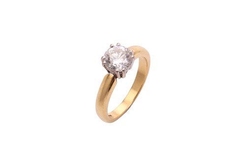 Lot 60 - An 18ct gold diamond solitaire ring, with a...