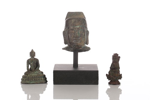 Lot 89 - A Chinese bronze bust of Buddha, a small...