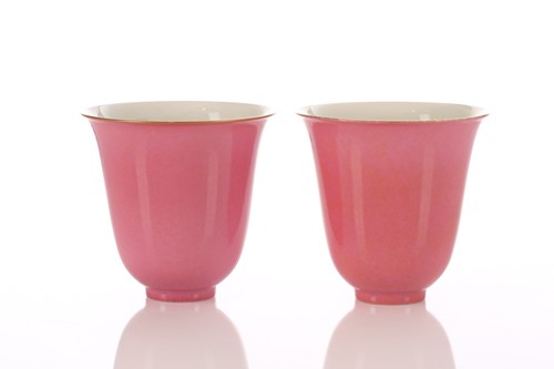 Lot 178 - A pair of Chinese peach bloom bell shape cups,...