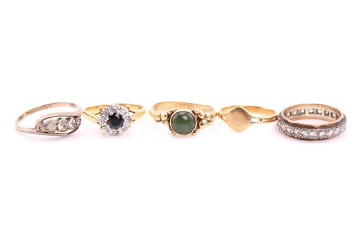 Lot 59 - An 18ct gold sapphire halo ring, and four...