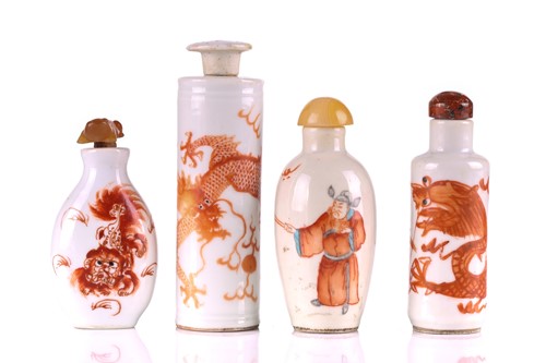 Lot 102 - Four Chinese iron red painted snuff bottles,...