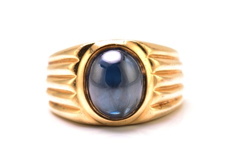 Lot 179 - A sapphire gypsy ring, featuring a high dome...