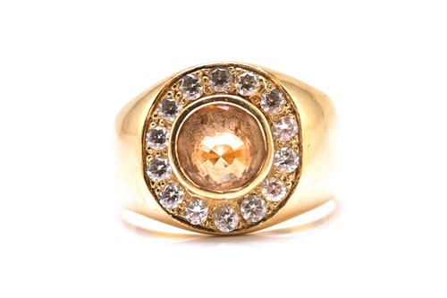 Lot 247 - A grossular garnet gypsy ring in yellow metal,...