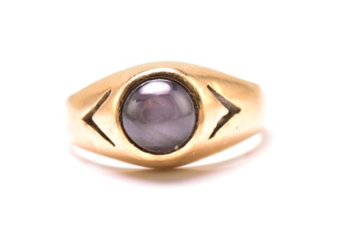 Lot 276 - A star sapphire gypsy ring, featuring a round...