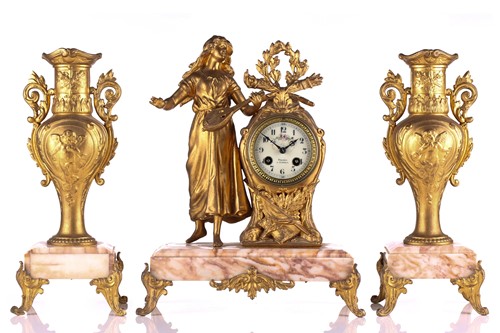 Lot 294 - An early 20th-century three-piece gilt metal...