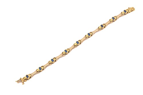 Lot 130 - A synthetic blue spinel bar link bracelet,...
