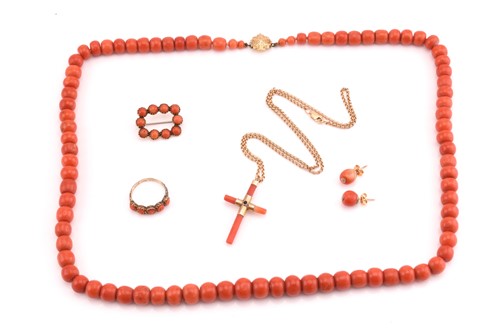 Lot 84 - A precious coral graduated bead necklace and a...