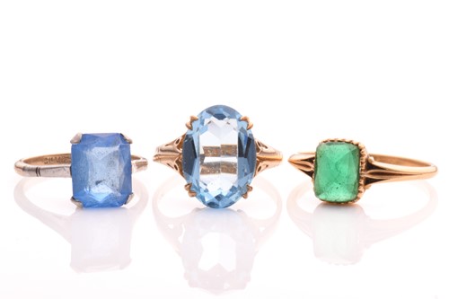Lot 279 - Three paste rings; to include a scissors-cut...