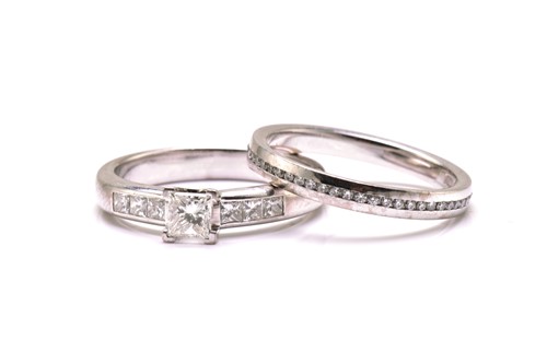 Lot 206 - A diamond engagement ring and an eternity ring...