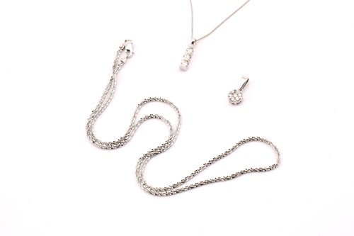 Lot 107 - A lot consists of two diamond pendants and a...
