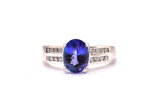 Lot 139 - An 18ct white gold tanzanite and diamond dress...