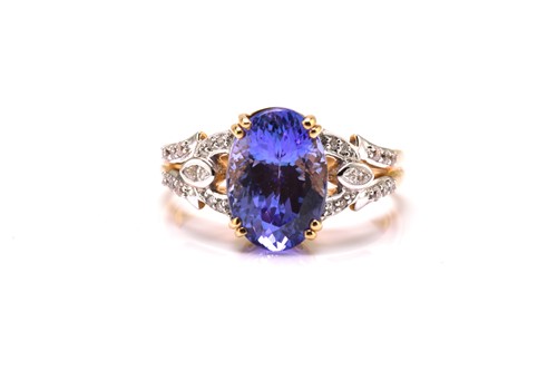 Lot 56 - An 18ct bi-coloured gold diamond and tanzanite...