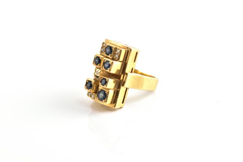 Lot 213 - A modernist sapphire and diamond ring,...