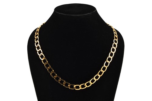 Lot 54 - A chunky curb link chain in yellow precious...