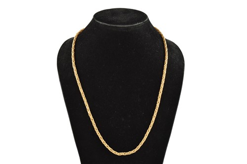 Lot 155 - A lariat necklace in yellow precious metal,...