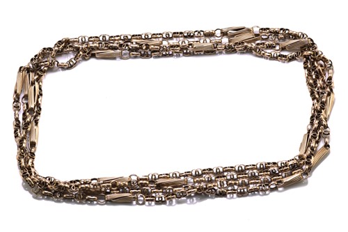 Lot 104 - An early 20th-century muff chain, with fancy...