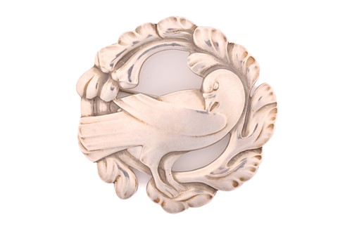 Lot 330 - Georg Jensen - An embossed silver brooch,...
