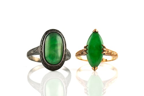 Lot 42 - Two jade rings, one comprises a...