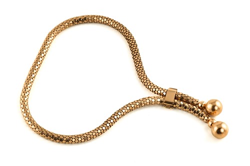 Lot 88 - A lariat necklace in yellow precious metal,...
