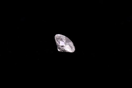 Lot 51 - A loose diamond, the round brilliant-cut white...