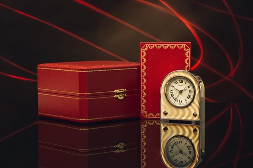 Lot 440 - A Cartier guilloche travel clock, with a...