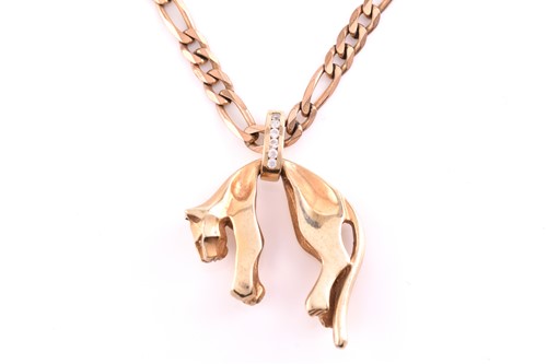 Lot 252 - A cat pendant on chain, depicting a stylised...