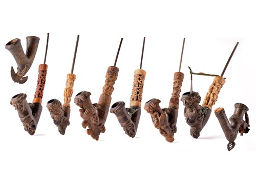 Lot 257 - A collection of Bamum pottery pipes, with...