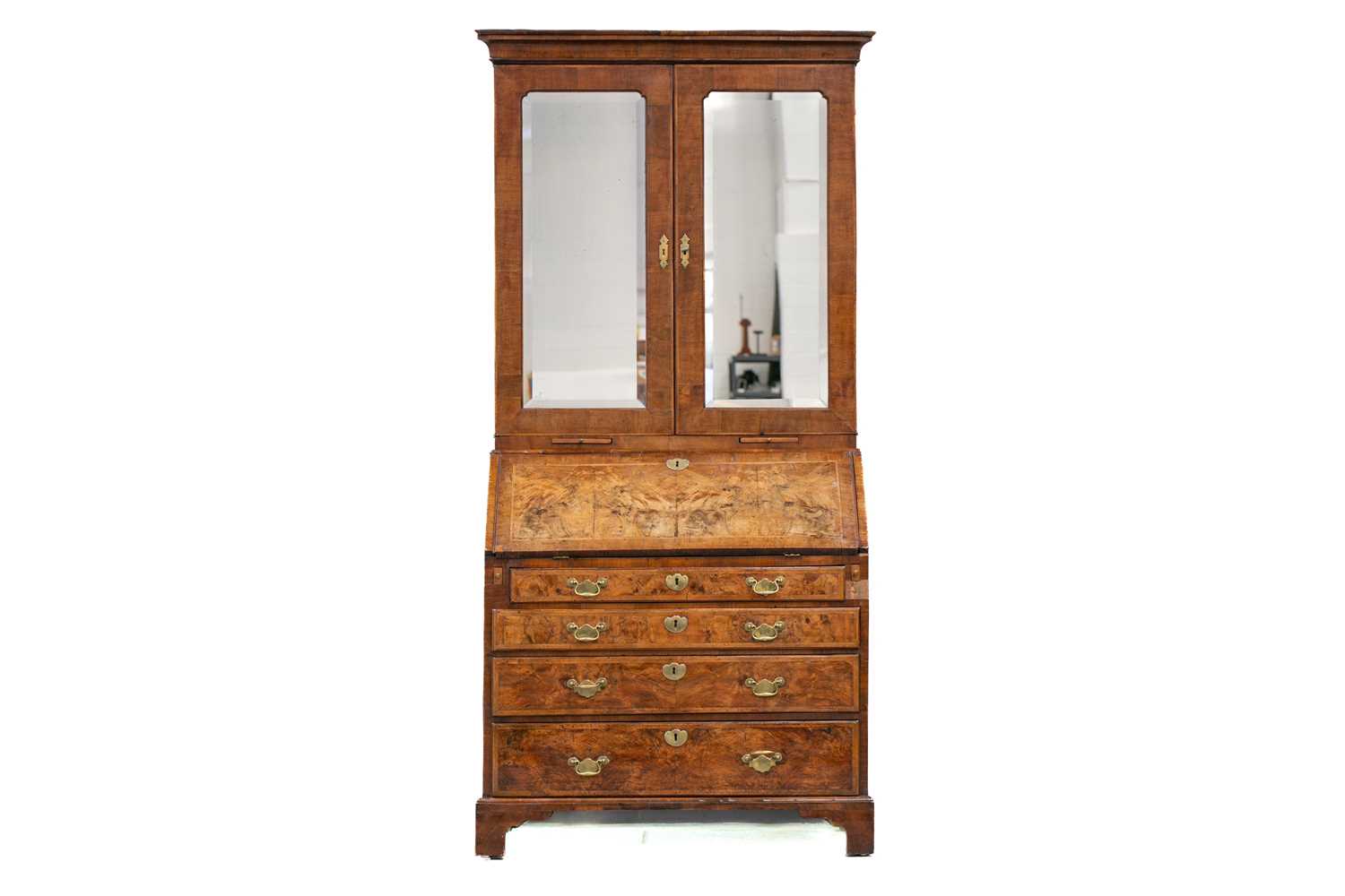 Lot 131 - A George I walnut bureau bookcase the upper...
