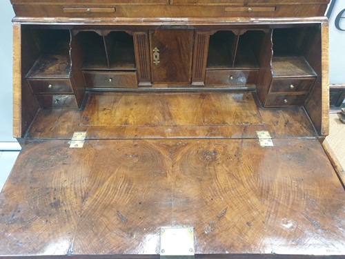 Lot 131 - A George I walnut bureau bookcase the upper...