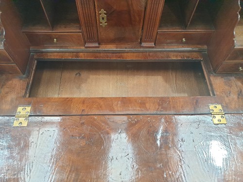 Lot 131 - A George I walnut bureau bookcase the upper...