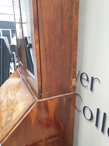 Lot 131 - A George I walnut bureau bookcase the upper...