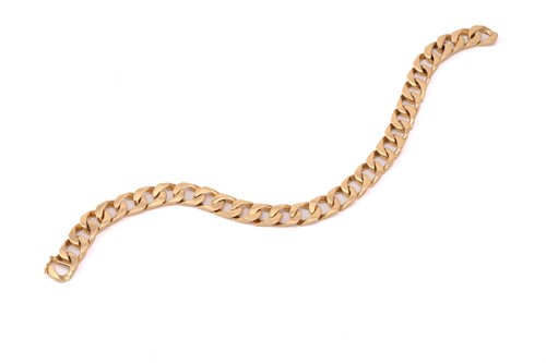 Lot 145 - A flat curb link bracelet, with a figure of...