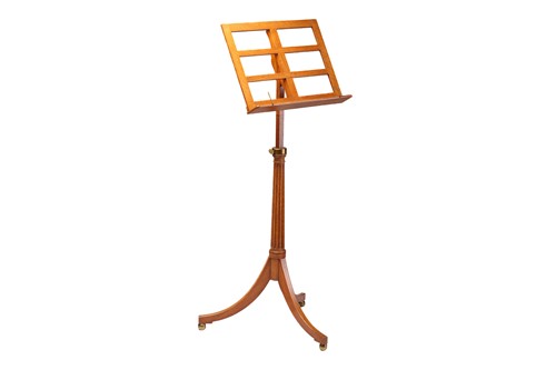 Lot 273 - An Edwardian golden oak adjustable music stand...