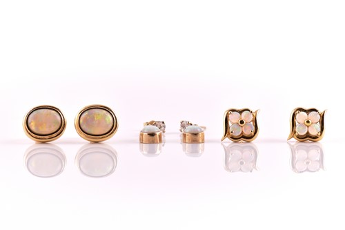Lot 102 - Three pairs of opal earrings in yellow gold,...