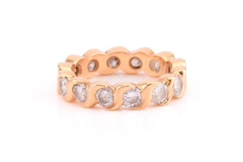 Lot 203 - A diamond eternity ring, comprises fourteen...