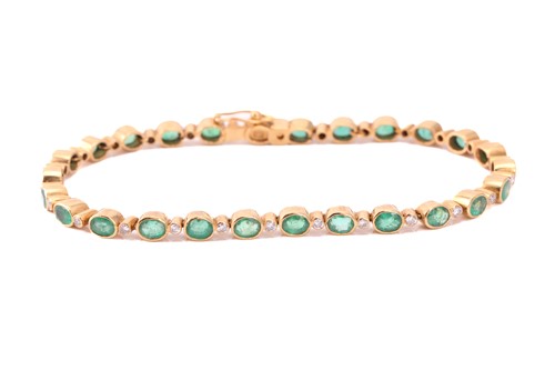 Lot 239 - An emerald and diamond bracelet in yellow...