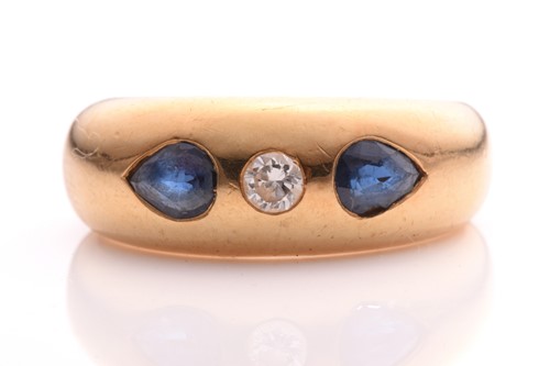 Lot 136 - A sapphire and diamond gypsy ring, consisting...