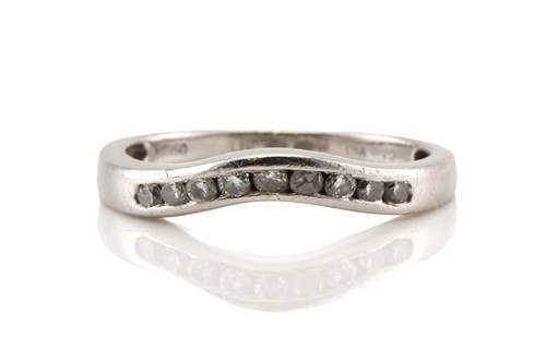 Lot 65 - A platinum and diamond guard band enhancer,...