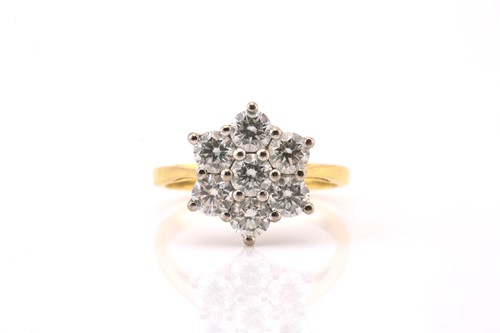 Lot 10 - An 18ct gold diamond cluster ring, comprises...