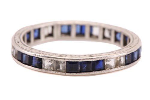 Lot 297 - An eternity ring with sapphires, consisting of...