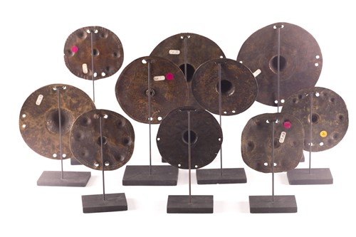 Lot 184 - A collection of twelve bronze shield bosses,...