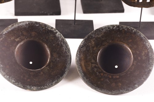 Lot 184 - A collection of twelve bronze shield bosses,...