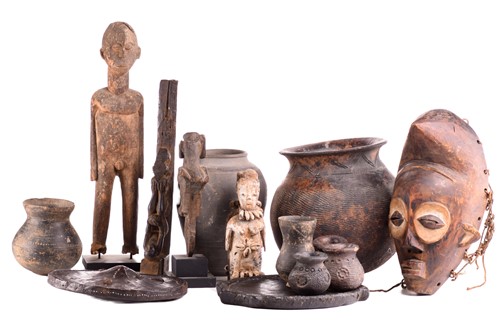 Lot 107 - Ethnographica comprising a hide parrying...