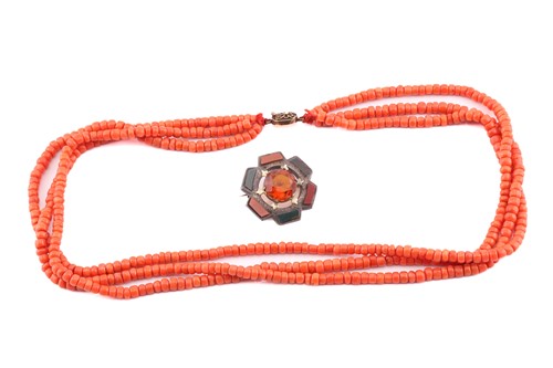 Lot 163 - A Scottish brooch and three-strand coral bead...