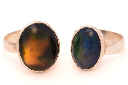 Lot 58 - Two black opal rings; First consists of an...