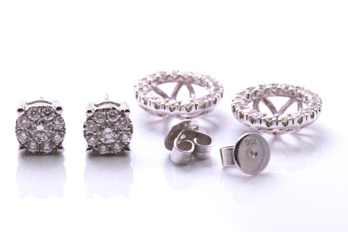 Lot 95 - A pair of diamond cluster ear studs with halo...