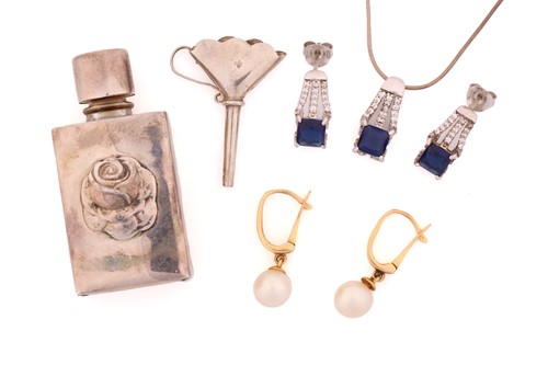 Lot 46 - A silver cased perfume bottle with funnel, a...