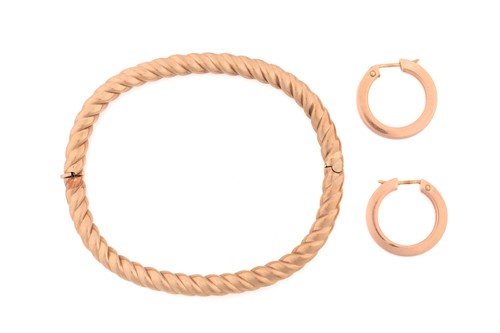 Lot 235 - A hinged bracelet and a pair of 9ct gold...