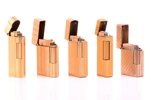Lot 284 - Dunhill. A gold plated Dunhill lighter, with...