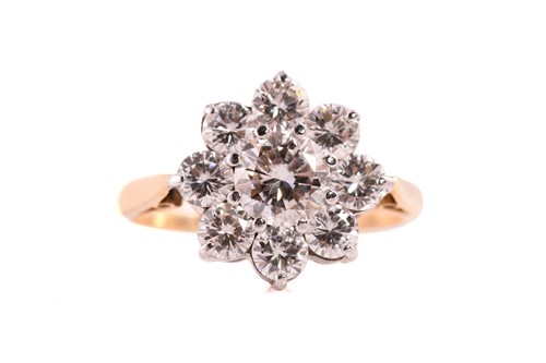 Lot 157 - A diamond cluster ring, featuring a round...